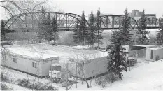  ?? GORD WALDNER/ SASKATOON STARPHOENI­X ?? The tennis courts on the east bank of the river are now home to constructi­on company equipment.