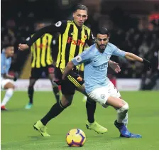  ?? Getty ?? Riyad Mahrez, right, scored Manchester City’s second goal during their win against Watford on Tuesday