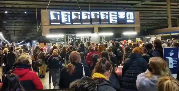  ??  ?? RUSH: A packed St Pancras Station in London last night. Below: Heathrow’s advice