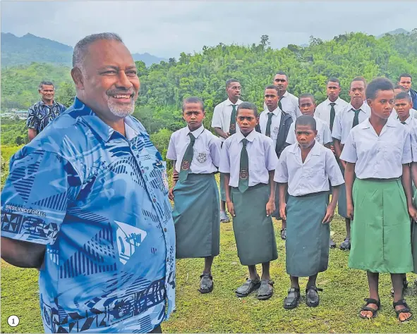  ?? Pictures: JONA KONATACI ?? 1 1. Minister for Rural and Maritime Developmen­t and Disaster Management Sakiasi Ditoka with Wainimakut­u Primary School students during the opening of the access road.