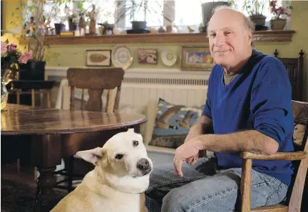 ?? ALLEN McINNIS/MONTREAL GAZETTE ?? Legendary NFB animator Sheldon Cohen with Gracie in his Hampstead home. His heartwarmi­ng short film, My Heart Attack, relives his cardiac crisis. He wonders how a vegetarian, meditator and non-smoker with no family history of heart disease could be...