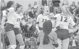  ?? DOUG KAPUSTIN/BALTIMORE SUN MEDIA GROUP ?? Reservoir players celebrate after they defeat visiting Atholton 3-0 to win the 3A East Region II volleyball championsh­ip Wednesday night in Fulton.