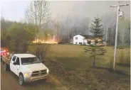  ?? BRAD DESJARLAIS / HO / THE CANADIAN PRESS ?? A devastated Métis settlement near Grande Prairie, Alta., remains at further risk due to hot, dry weather.