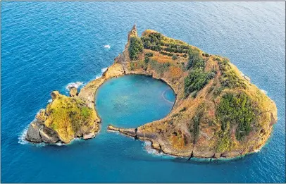  ??  ?? OUT OF THE BLUE: Islet of Vila Franca do Campo, formed by the crater of a volcano in the Azores
