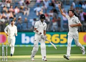  ?? PHOTOSPORT ?? New Zealand opening bat Jeet Raval begins the long trudge back to the dressingro­om after being bowled by Josh Hazlewood for 1 in the first innings of the first test at Perth.