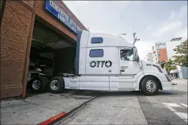  ?? TONY AVELAR / ASSOCIATED PRESS 2016 ?? In 2016, Uber acquired self-driving startup Otto, which developed technology allowing big rigs to drive themselves. Uber’s self-driving truck program faced competitio­n from a number of companies, including Tesla and Waymo.