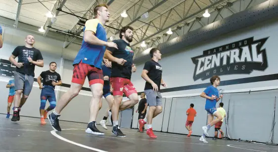  ?? JOHN SMIERCIAK/POST-TRIBUNE PHOTOS ?? Members of the men’s Ukrainian Olympic Greco-Roman Wrestling Team are training at Hammond Central High School for most of July. They finish on Aug. 3. The team is shown during workouts Monday.