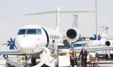  ?? Ahmed Ramzan/ Gulf News ?? Visitors look at a G650 aircraft at the Dubai Air Show 2017 being held at Dubai World Central.