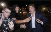  ?? TOM FOX — THE DALLAS MORNING NEWS ?? Actor Jeremy Allen White takes photos with fans as he arrives to the red carpet for the world premiere of “The Iron Claw” at the Texas Theatre in Dallas on Nov. 8, 2023.