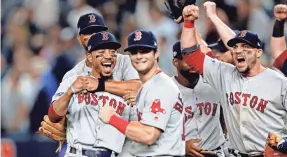  ?? NOAH K. MURRAY/USA TODAY SPORTS ?? The Red Sox celebrate beating the Yankees to advance to the ALCS, but can MLB celebrate its attendance and ratings numbers?
