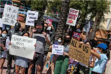  ?? (Brian van der Brug/Los Angeles Times/TNS) ?? DEMONSTRAT­ORS GATHER to protest racism, in Alhambra, California, last week.