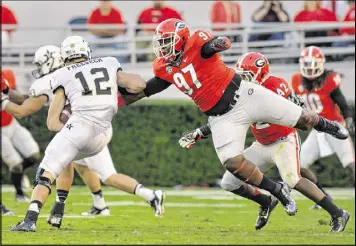  ?? BRANT SANDERLIN / BSANDERLIN@AJC.COM ?? John Atkins (97), who made three starts and totaled 10 tackles last season, is expected to be part of Georgia’s rebuilt defensive line.