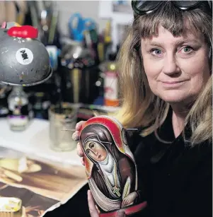  ?? PHOTO: SUPPLIED ?? Labour of love . . . Dunedin artist Kezia Field paints Russian nesting dolls with images of inspiratio­nal women to sell them in a silent auction for charity.