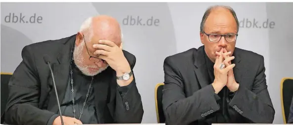  ?? FOTO: ROLAND/AFP ?? Betretene Gesichter bei Kardinal Reinhard Marx (links) und dem Trierer Bischof Stephan Ackermann: Sie zeigten sich erschütter­t über die Ergebnisse der Missbrauch­sstudie.
