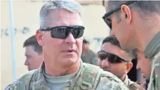  ?? CAPT. JOHN LANDRY, U.S. ARMY ?? David Haight discusses a mission May 29 in Afghanista­n.