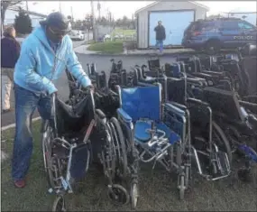  ?? PETE BANNAN – DIGITAL FIRST MEDIA ?? Paris Eleby came from Germantown with adult diapers and toiletries; he then stayed to help sort the donations.