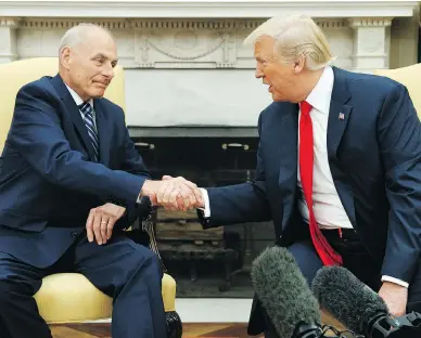  ?? EVAN VUCCI/THE ASSOCIATED PRESS ?? U.S. President Donald Trump meets with new White House Chief of Staff John Kelly after he was sworn in at the Oval Office on Monday. Kelly has been tasked with saving the White House from itself, Matthew Fisher writes.
