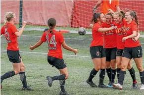  ?? PHOTOSPORT ?? Canterbury’s Gabi Rennie celebrates a goal with team-mates. It was the only goal of the match as the Pride beat Auckland 1-0.