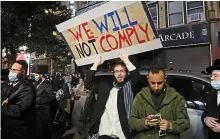  ??  ?? Breaking laws: Antilockdo­wn protesters gather in Brooklyn to denounce rules after a spike in Covid cases