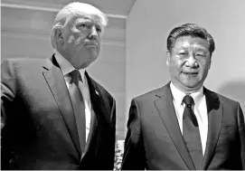  ?? REUTERS ?? A July 2017 picture of US President Donald Trump and Chinese President Xi Jinping meeting on the sidelines of the G20 Summit