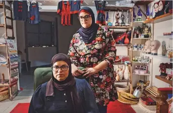  ?? New York Times ?? Watfa Jabali, who lost a son to gun violence, at her shop with her daughter, in Taibeh. There were 16 homicides in Israel’s Arab communitie­s last month and nearly 100 so far this year.