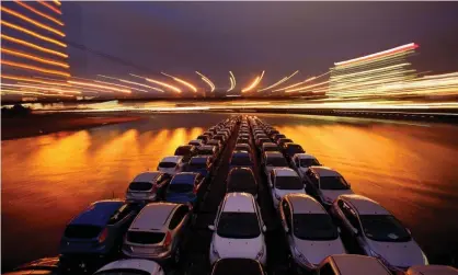  ??  ?? Ford vehicles transporte­d down the Rhine. Photograph: Oliver Berg/EPA