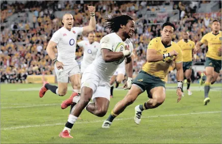  ?? Picture: EPA ?? TRY TIME: Wing Marland Yarde of England crosses the line to score as Christian Lealiifano is too late to stop him during yesterday’s first Test against Australia at the Suncorp Stadium in Brisbane.