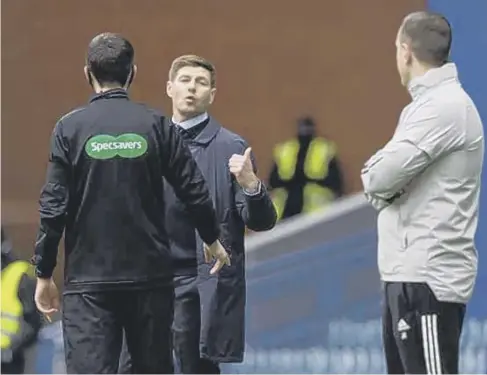  ??  ?? Steven Gerrard makes his point to Celtic interim manager John Kennedy during the closing stages of the game yesterday