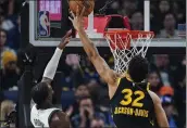  ?? GODOFREDO A. VÁSQUEZ — THE ASSOCIATED PRESS ?? Golden State Warriors forward Trayce Jackson-Davis (32) blocks a shot by Boston Celtics forward Jaylen Brown during the first half Tuesday in San Francisco.