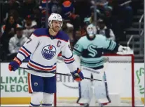  ?? LINDSEY WASSON — THE ASSOCIATED PRESS ?? Edmonton Oilers center Connor McDavid (97) smiles after scoring a goal against the Seattle Kraken during the third period on Friday.