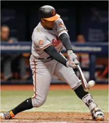  ?? AP PHOTO ?? RIGHT ON THE BALL: Jonathan Schoop connects for a sacrifice fly during the Orioles’ 5-0 victory against the Rays last night in St. Petersburg, Fla.