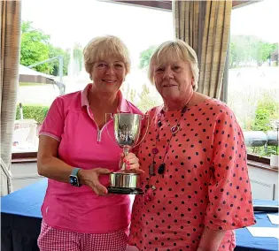  ?? ?? Bath Golf Club’s Steph Anderson, left, received the Ladies’ Club Championsh­ip trophy from captain Heather Cottle