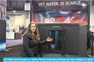  ?? ?? LAS VEGAS: Genesis Systems co-founder Shannon Stuckenber­g discusses the inner workings of a WaterCube device that extracts water from the air during the Consumer Electronic­s Show (CES) in Las Vegas, Nevada, on January 12, 2024. -- AFP