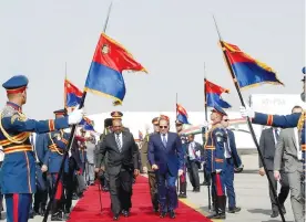  ?? (The Egyptian Presidency/Handout via Reuters) ?? EGYPTIAN PRESIDENT Abdel Fattah al-Sisi inspects an honor guard with his Sudanese counterpar­t Omar al-Bashir, upon his arrival at Cairo’s Airport in January 2019.