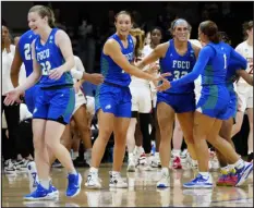  ?? MATT ROURKE — THE ASSOCIATED PRESS ?? Florida Gulf Coast players react after beating Washington State in the NCAA Tournament Saturday in Villanova, Pa.