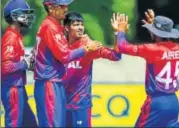  ?? ICC ?? Nepal players celebrate after beating Papua New Guinea in the World Cup Qualifier. The result handed them ODI status.