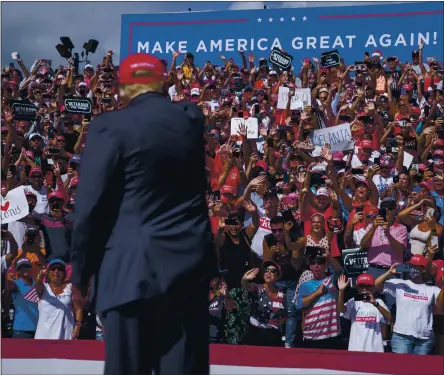  ?? EVAN VUCCI — THE ASSOCIATED PRESS ?? Supporters cheer as President Donald Trump arrives for a campaign rally outside Raymond James Stadium on Thursday in Tampa, Fla.