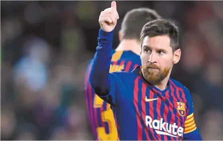  ?? AFP-Yonhap ?? Barcelona’s Argentinia­n forward Lionel Messi celebrates his goal during the Spanish League football match against SD Eibar at the Camp Nou stadium in Barcelona, Sunday.