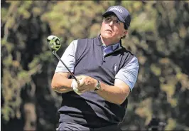  ?? GETTY IMAGES ?? Phil Mickelson watches his tee shot on No. 8 during Thursday’s first round of the WGCMexico Championsh­ip. Mickelson fired a 4-under-par 67 to share the lead.