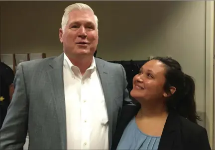  ?? CARL HESSLER JR. — MEDIANEWS GROUP ?? Karissa Rivera, 22, of Horsham, beamed with joy as her mentor, William Thomas Stockdale, a retired sergeant with the Las Vegas Metropolit­an Police Department, surprised her by attending her swearing-in ceremony as a Montgomery County deputy sheriff.