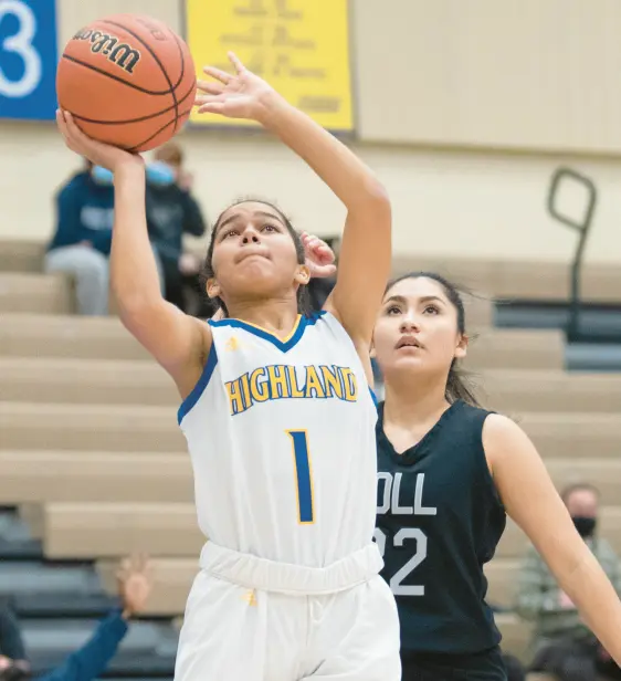  ?? ?? Highland’s Aaliyah Keil puts up a shot as Bishop Noll’s Rose Fuentes defends during their game Dec. 15. KYLE TELECHAN/POST-TRIBUNE