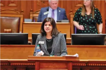  ?? NATRICE MILLER/ATLANTA JOURNAL-CONSTITUTI­ON ?? Saira Draper, D-Atlanta, speaks on day 39 of the legislativ­e session at the Georgia State Capitol in 2023. Draper will face fellow Democrat Becky Evans in November.