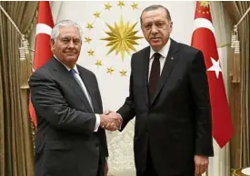 ?? —AP ?? REPAIRING TIES Turkey President Recep Tayyip Erdogan (right) and US Secretary of State Rex Tillerson shake hands before their talks in Ankara.