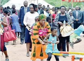  ??  ?? First Lady Cde Auxillia Mnangagwa plays with children at a children’s home in Binga yesterday