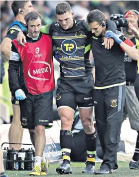  ??  ?? Unhappy end: George North leaves the field after being injured for Northampto­n