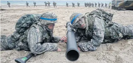  ?? EPA ?? South Korean marines participat­e in an annual amphibious operations during the annual Foal Eagle exercises against a possible attack from N Korea, in Pohang, 360km southeast of Seoul, on Sunday. The annual exercises with US Combined Forces Command last...