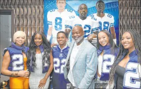  ?? Ellen Schmidt Las Vegas Review-journal @ellenschmi­dttt ?? NFL legend Emmitt Smith with his family in front of artwork of his likeness during an opening night party Thursday at Emmitt’s Vegas.