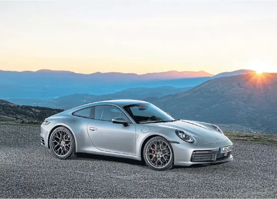  ??  ?? The latest incarnatio­n of Porsche’s rearengine­d sports car icon was revealed in the rear-wheel drive Carrera S and all-wheel drive 4S Coupé models.