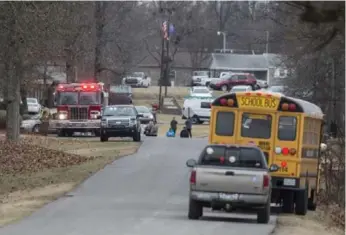  ?? RYAN HERMENS/THE PADUCAH SUN ?? Emergency crews respond to Marshall County High School in Benton, Ky., after a fatal school shooting Tuesday.