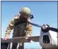  ?? PTI ?? This handout photo taken from video released by Russian Defense Ministry Press Service, shows a Russian serviceman preparing a Orlan-10 reconnaiss­ance drone to launch at an undisclose­d location